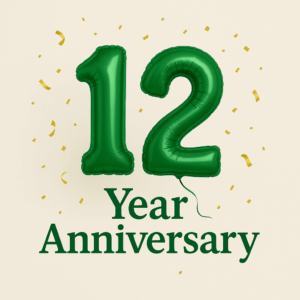 Green foil balloons forming the number 12 with gold confetti on a light background, celebrating a 12-year anniversary.